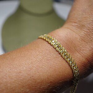 Women`s gold tone bracelet crystal accents. 7 inch